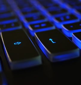 LearnOnline Fast Track Computer Science A level Self-study Close up of computer keyboard with blue lighting