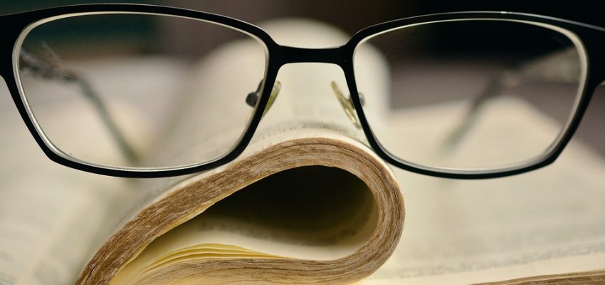 LearnOnline Self-study IGCSE Religious Studies - book with glasses on top