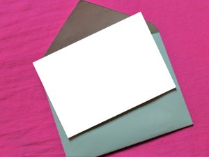 LearnOnline Exams Post Result Service - blank piece of paper on envelope with pink background