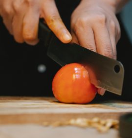 LearnOnline Food Hygiene Awareness Business Training Courses Knife cutting tomato