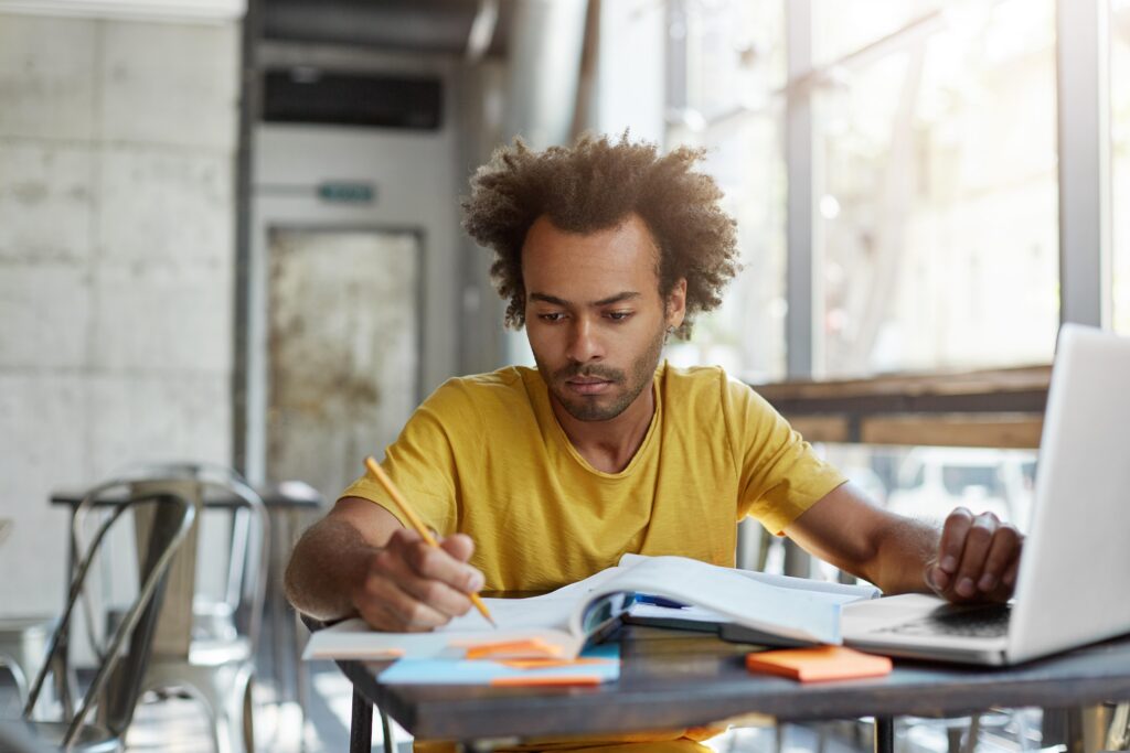 Young adult studying at desk