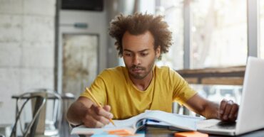 Young adult studying at desk